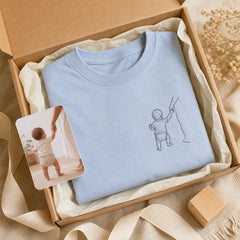 Custom Baby First Steps Photo Embroidered T-Shirt - Personalized Milestone Gift gift display image with custom left chest embroidery based on baby first steps or hand-in-hand walking photo