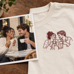 Custom Couple Coffee Date Outline Embroidered T-Shirt with Back Print - Anniversary Gift source photo and front embroidery product image with custom left chest embroidery based on candid couple sharing coffee at a small cafe table