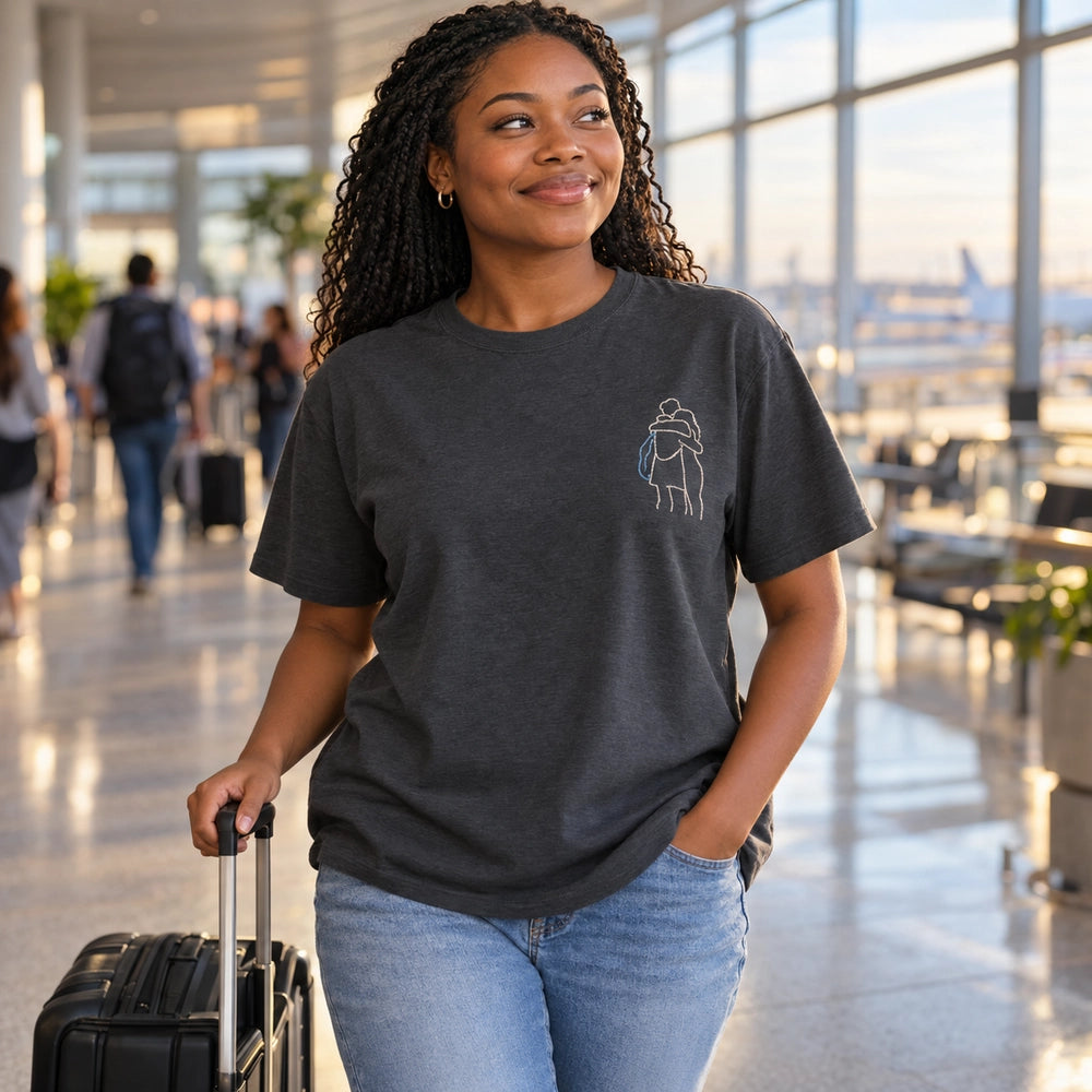 Custom Long Distance Couple Reunion Outline Embroidered T-Shirt with Back Print - Relationship Gift front worn product image with left chest embroidery with custom left chest embroidery based on couple embracing at an airport or train station reunion