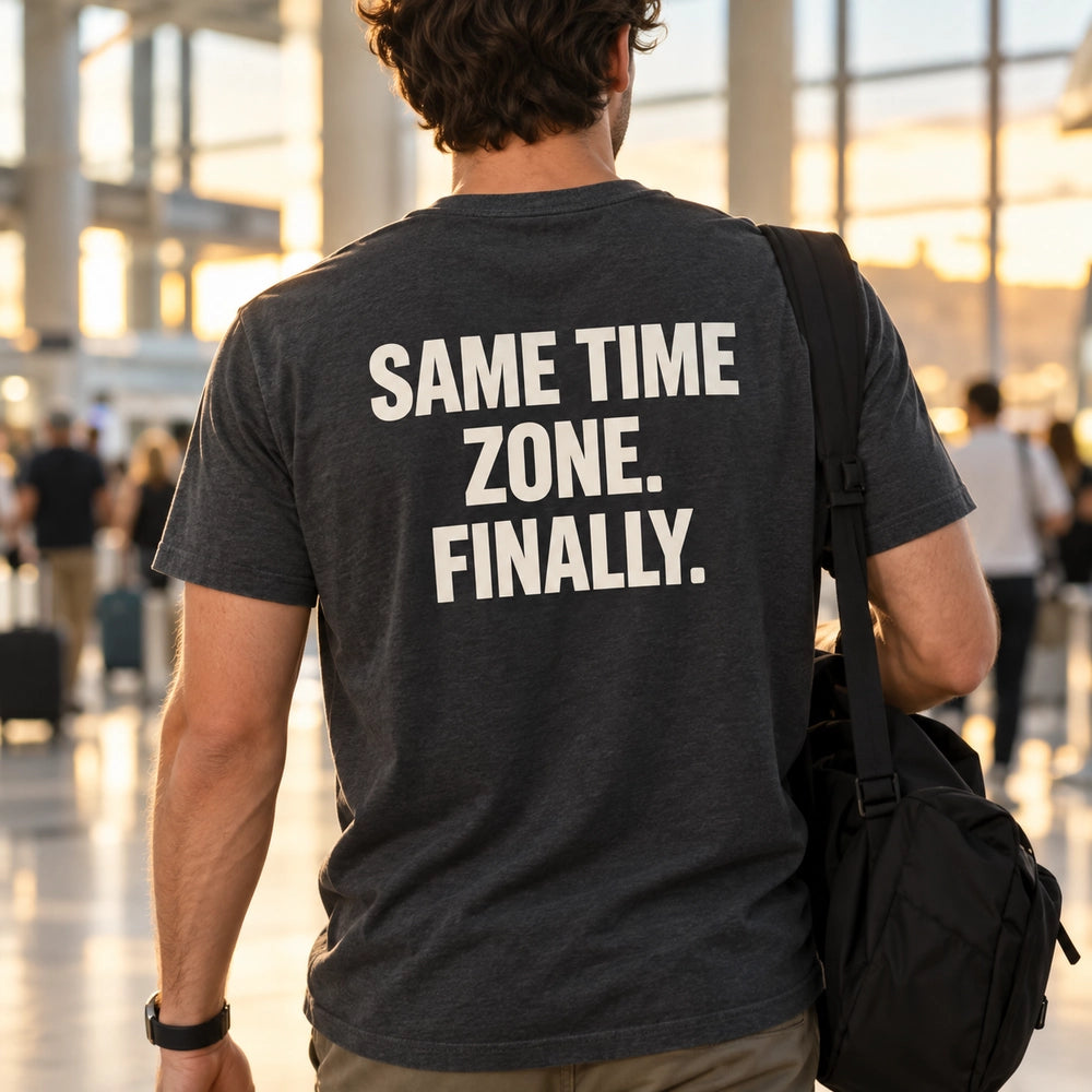 Custom Long Distance Couple Reunion Outline Embroidered T-Shirt with Back Print - Relationship Gift back worn product image with custom printed phrase with custom left chest embroidery based on couple embracing at an airport or train station reunion