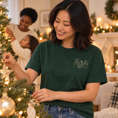 Custom Christmas Tree Star Family Outline Embroidered T-Shirt with Back Print - Holiday Gift front worn product image with left chest embroidery with custom left chest embroidery based on three family members passing a star at the Christmas tree