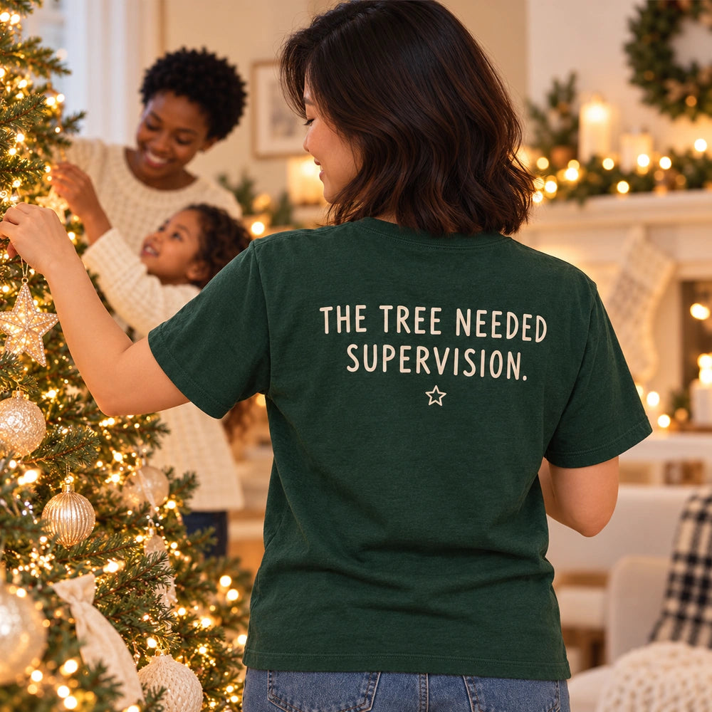 Custom Christmas Tree Star Family Outline Embroidered T-Shirt with Back Print - Holiday Gift back worn product image with custom printed phrase with custom left chest embroidery based on three family members passing a star at the Christmas tree